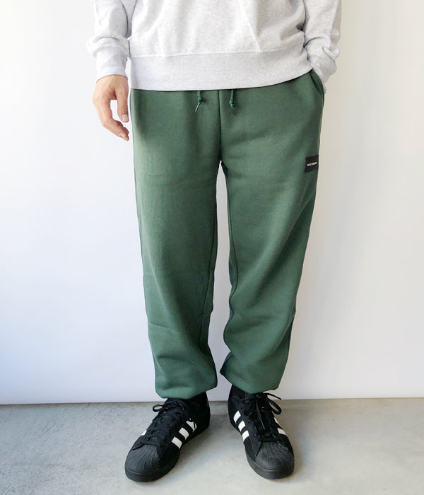 DESCENDANT/DEVICE SWEAT TROUSERS (GREEN)